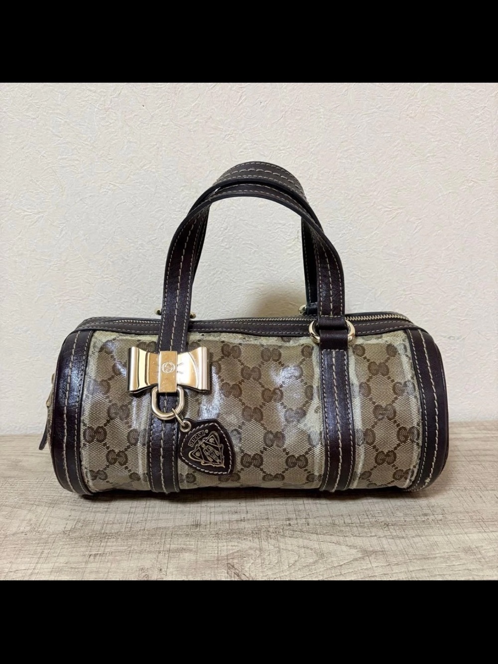 Gucci Brown Monogram Mini Barrel Bag with Gold Bow Accent